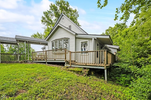379 N Marion St, Morgantown, IN 46160 - back of property featuring a wooden deck and a lawn