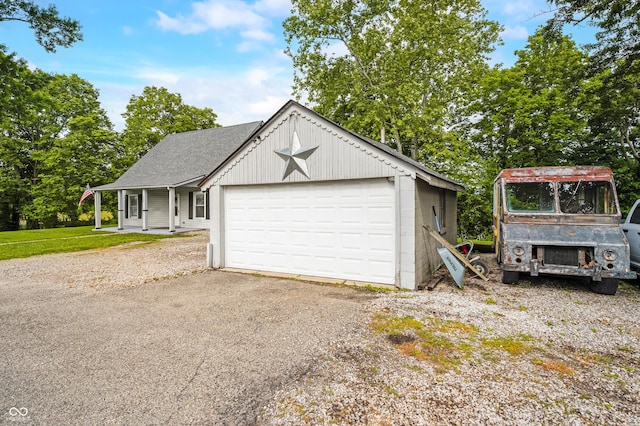 379 N Marion St, Morgantown, IN 46160 - view of front of house featuring a garage and a shingled roof