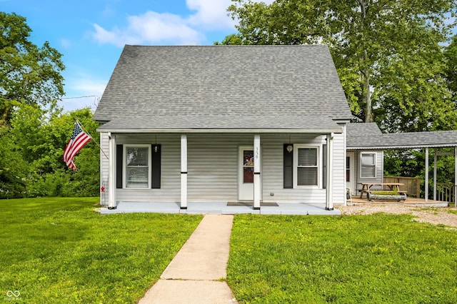 379 N Marion St, Morgantown, IN 46160 - view of front of home with roof with shingles, a front lawn, and covered porch