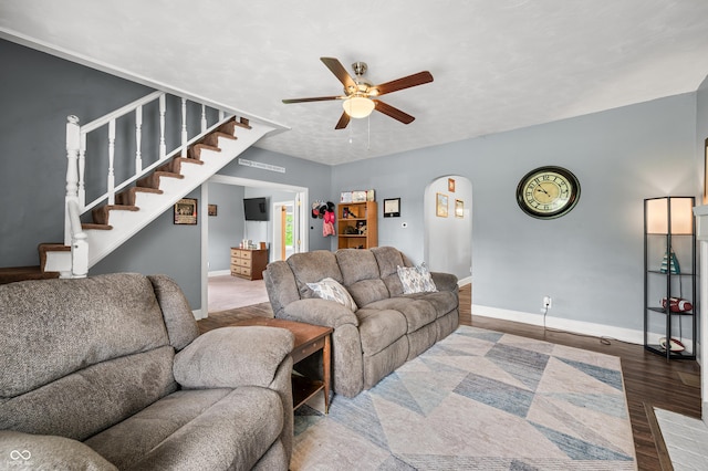 379 N Marion St, Morgantown, IN 46160 - living room featuring a ceiling fan, wood finished floors, stairs, and baseboards