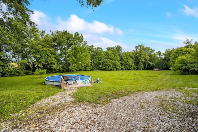379 N Marion St, Morgantown, IN 46160 - view of green lawn with an outdoor pool and a patio