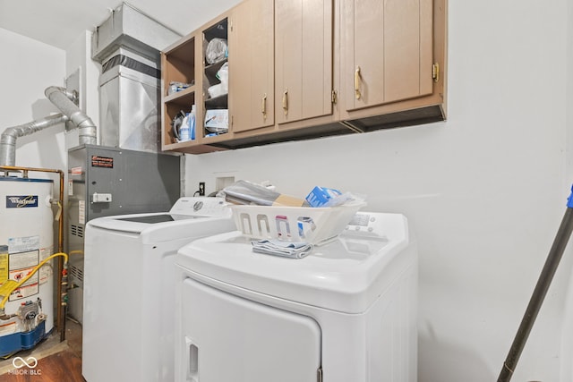 1116 N Berwick Ave, Indianapolis, IN 46222 - laundry area featuring separate washer and dryer, cabinet space, gas water heater, and dark wood-style floors