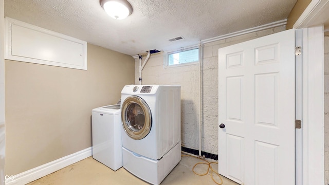 311 S 6th Ave, Beech Grove, IN 46107 - washroom with independent washer and dryer, a textured ceiling, and baseboards