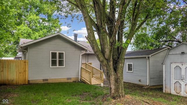 311 S 6th Ave, Beech Grove, IN 46107 - back of house featuring crawl space and a shingled roof