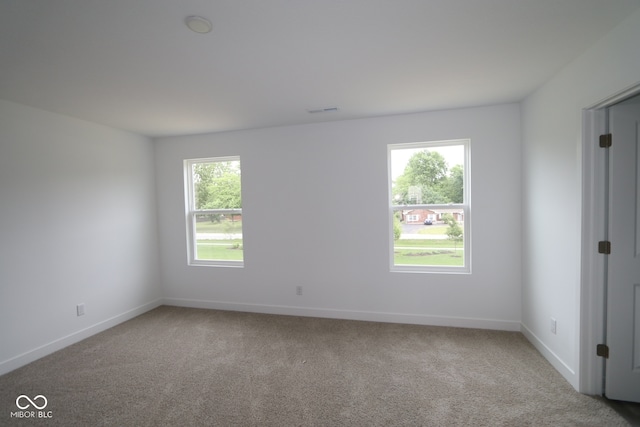 3917 Highcrest Rd, Indianapolis, IN 46239 - spare room with carpet flooring, plenty of natural light, and baseboards