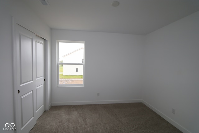 3917 Highcrest Rd, Indianapolis, IN 46239 - unfurnished bedroom featuring baseboards and carpet