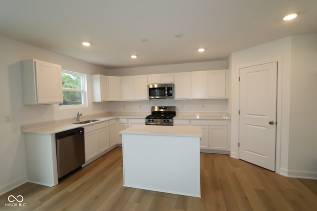 3917 Highcrest Rd, Indianapolis, IN 46239 - kitchen with stainless steel appliances, a sink, light wood-style flooring, light countertops, and recessed lighting
