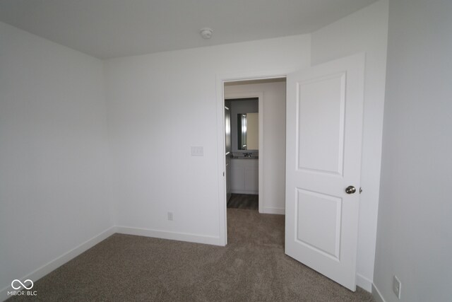 3917 Highcrest Rd, Indianapolis, IN 46239 - unfurnished bedroom featuring carpet and baseboards