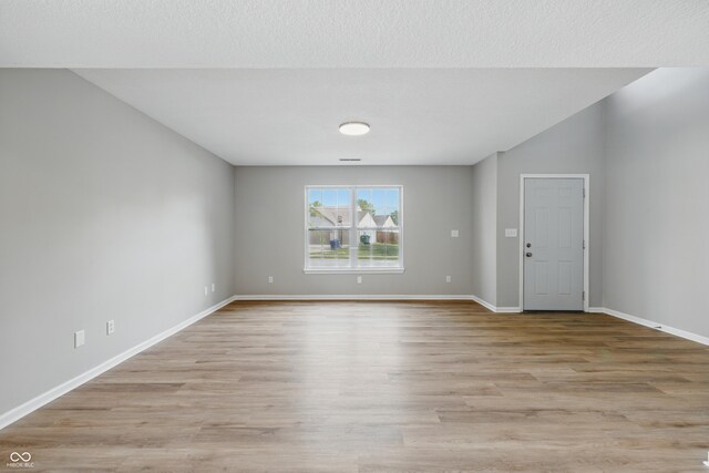 9949 Nightsong Ln, Avon, IN 46123 - unfurnished room with light wood-style floors and baseboards