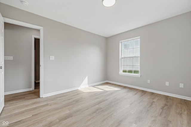 9949 Nightsong Ln, Avon, IN 46123 - unfurnished room featuring light wood-style flooring, baseboards, and a smoke detector