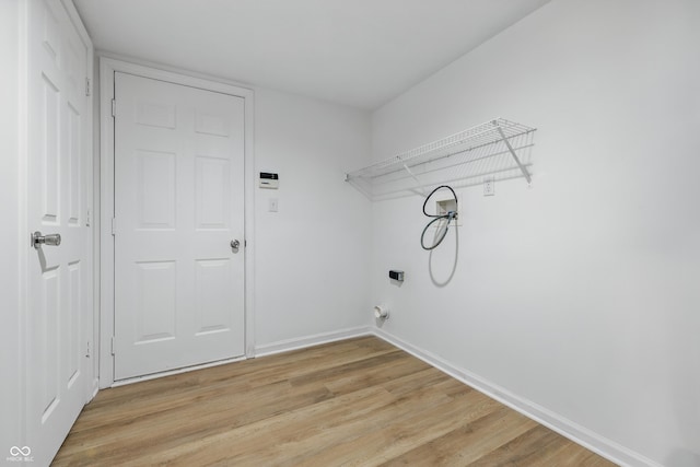9949 Nightsong Ln, Avon, IN 46123 - washroom featuring hookup for a washing machine, light wood-type flooring, electric dryer hookup, and baseboards