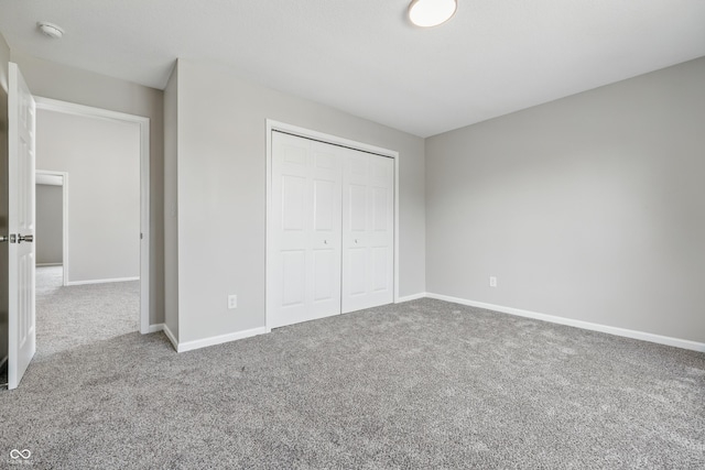 9949 Nightsong Ln, Avon, IN 46123 - unfurnished bedroom featuring carpet flooring, baseboards, and a closet