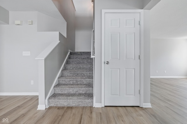 9949 Nightsong Ln, Avon, IN 46123 - stairs featuring wood finished floors and baseboards