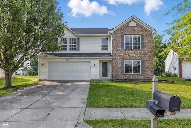 9949 Nightsong Ln, Avon, IN 46123 - traditional home featuring concrete driveway, a front lawn, brick siding, and a garage