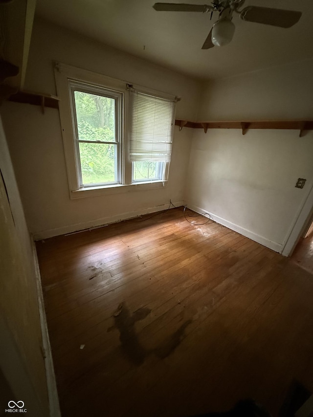 4931 Orion Ave, Indianapolis, IN 46201 - unfurnished bedroom with hardwood / wood-style flooring, baseboards, and ceiling fan