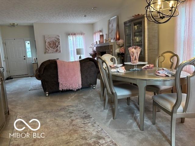 6730 NW Shanghai Cir, Indianapolis, IN 46268 - carpeted dining area with a chandelier, plenty of natural light, and a textured ceiling