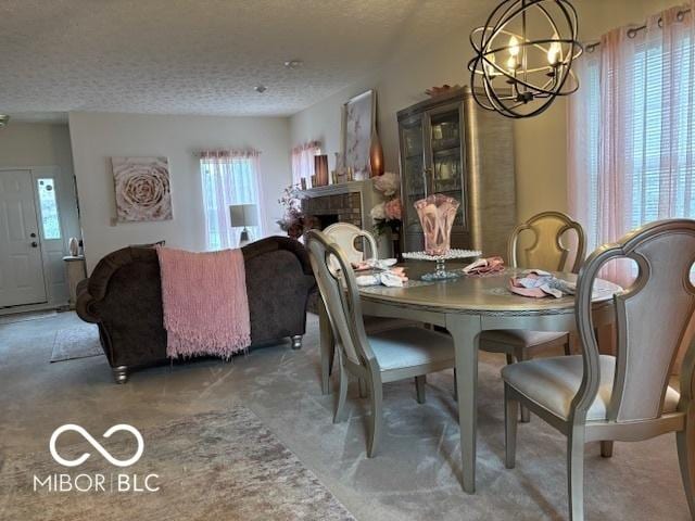 6730 NW Shanghai Cir, Indianapolis, IN 46268 - carpeted dining space with a chandelier and a textured ceiling