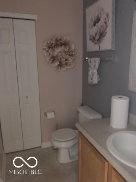 6730 NW Shanghai Cir, Indianapolis, IN 46268 - bathroom featuring vanity, tile patterned flooring, and a closet