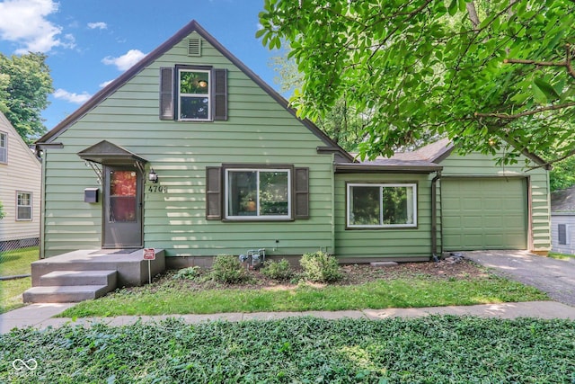 4708 Haverford Ave, Indianapolis, IN 46205 - view of front of property with driveway and an attached garage