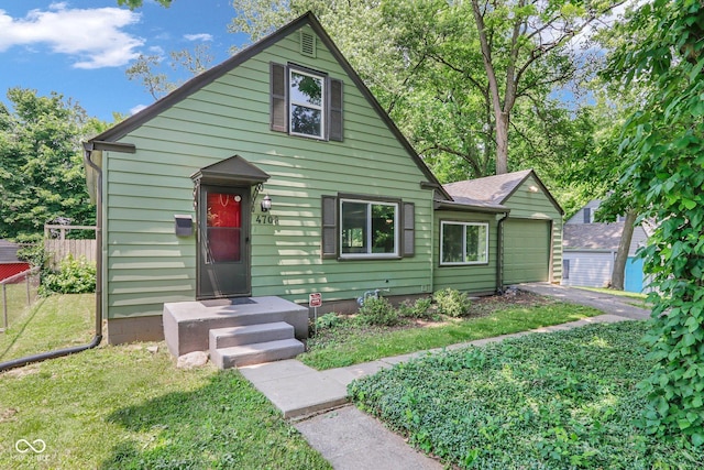 4708 Haverford Ave, Indianapolis, IN 46205 - view of front of home featuring a garage and asphalt driveway