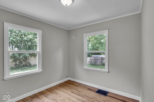4708 Haverford Ave, Indianapolis, IN 46205 - empty room featuring wood finished floors and ornamental molding