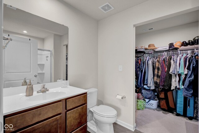 7171 E Rising Sun Cir S, Camby, IN 46113 - bathroom with vanity, a spacious closet, toilet, and a shower