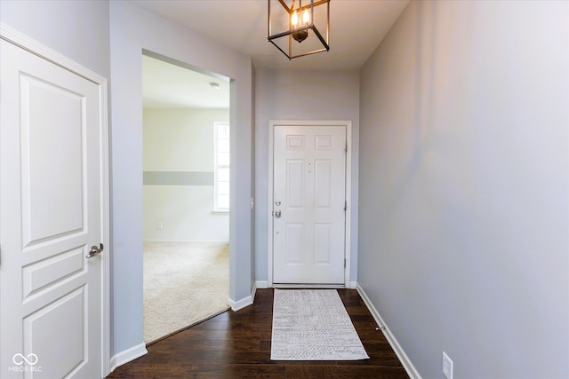 12820 Gloria Dr, Fishers, IN 46037 - doorway featuring dark wood-style floors and a chandelier