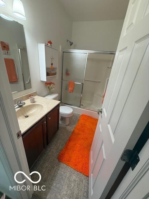 5304 Appleseed Way, Indianapolis, IN 46217 - bathroom featuring an enclosed shower, vanity, and toilet