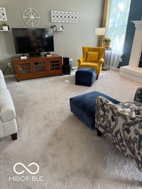 5304 Appleseed Way, Indianapolis, IN 46217 - living room featuring carpet and a fireplace