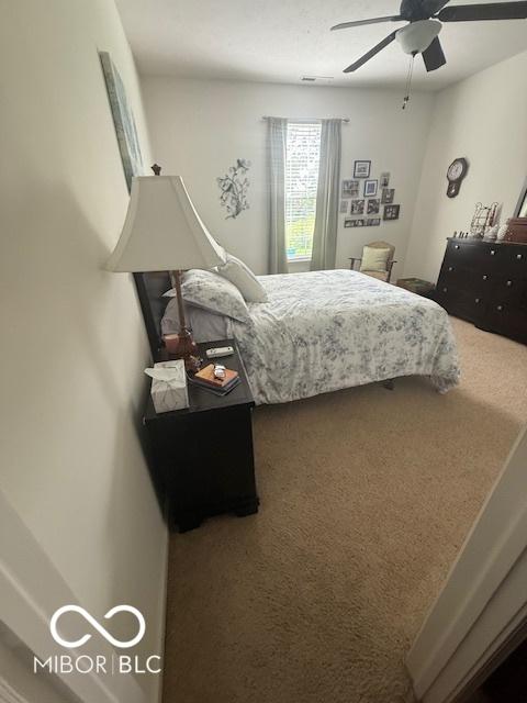 5304 Appleseed Way, Indianapolis, IN 46217 - bedroom featuring carpet floors and ceiling fan