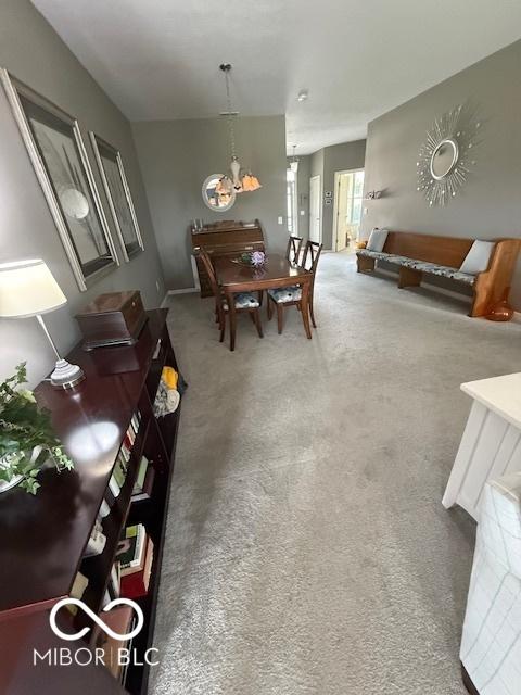 5304 Appleseed Way, Indianapolis, IN 46217 - carpeted dining space featuring a chandelier