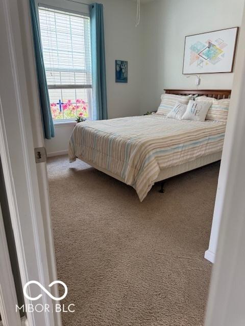 5304 Appleseed Way, Indianapolis, IN 46217 - bedroom with carpet flooring and baseboards