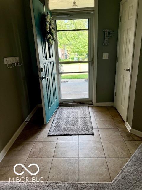 5304 Appleseed Way, Indianapolis, IN 46217 - entryway featuring baseboards and light tile patterned floors