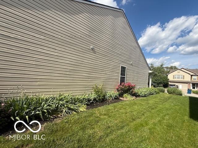 5304 Appleseed Way, Indianapolis, IN 46217 - view of property exterior featuring a lawn