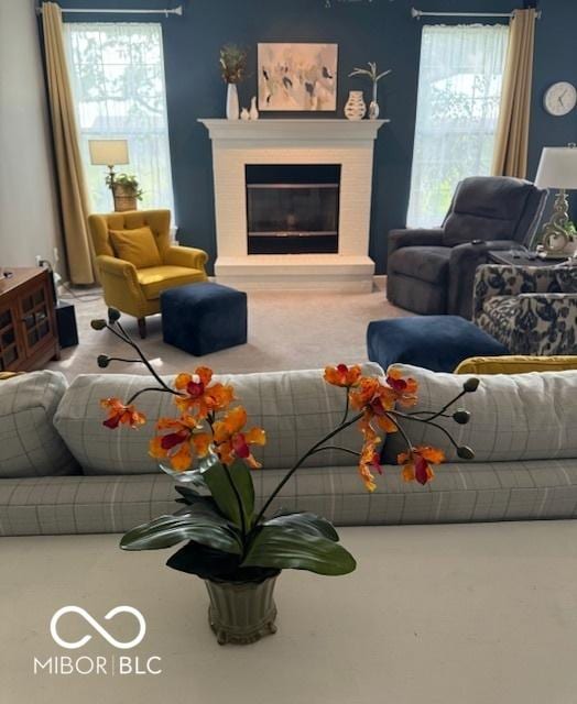 5304 Appleseed Way, Indianapolis, IN 46217 - living room featuring carpet flooring and a glass covered fireplace