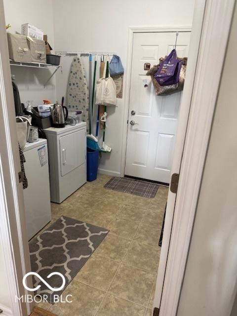 5304 Appleseed Way, Indianapolis, IN 46217 - washroom with washing machine and dryer and tile patterned flooring