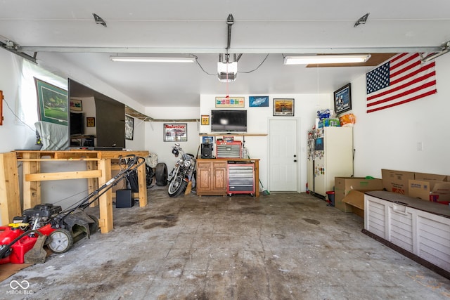 258 N Green Springs Rd, Indianapolis, IN 46214 - garage featuring a workshop area and a garage door opener