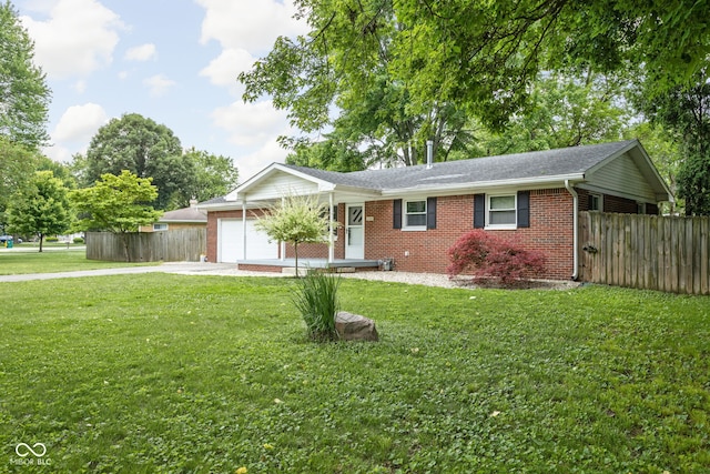 258 N Green Springs Rd, Indianapolis, IN 46214 - ranch-style home with concrete driveway, a garage, brick siding, and a shingled roof