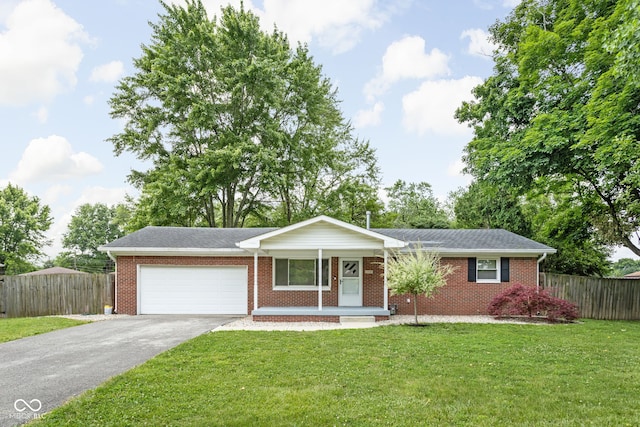 258 N Green Springs Rd, Indianapolis, IN 46214 - single story home with asphalt driveway, an attached garage, covered porch, and brick siding