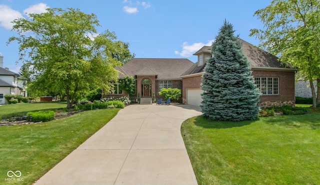 11761 Darsley Dr, Fishers, IN 46037 - view of front facade featuring brick siding, driveway, a front lawn, and an attached garage