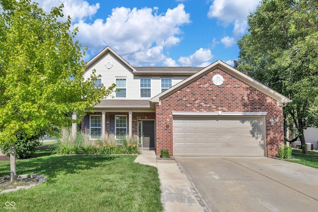 2211 Willowview Dr, Indianapolis, IN 46239 - traditional home featuring brick siding, a garage, a front yard, and concrete driveway