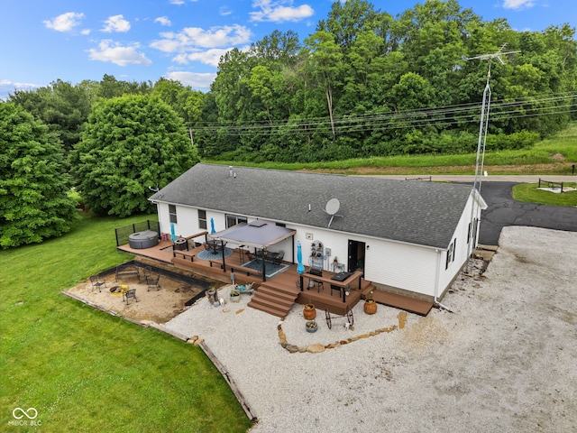 527 E 125 S, Williamsport, IN 47993 - back of house with a wooden deck, roof with shingles, a lawn, and a fire pit
