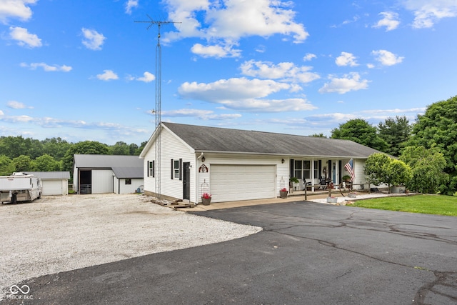 527 E 125 S, Williamsport, IN 47993 - ranch-style home with an attached garage, driveway, and a porch