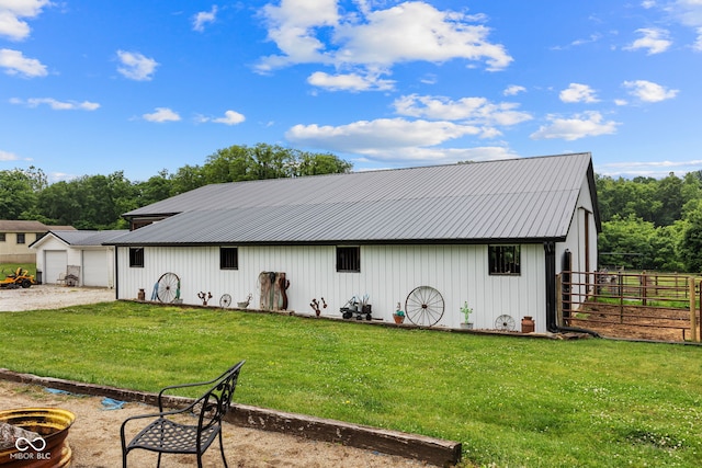 527 E 125 S, Williamsport, IN 47993 - back of house featuring a pole building, metal roof, an outdoor structure, and a detached garage
