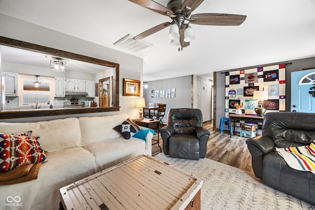 527 E 125 S, Williamsport, IN 47993 - living room with ceiling fan and wood finished floors