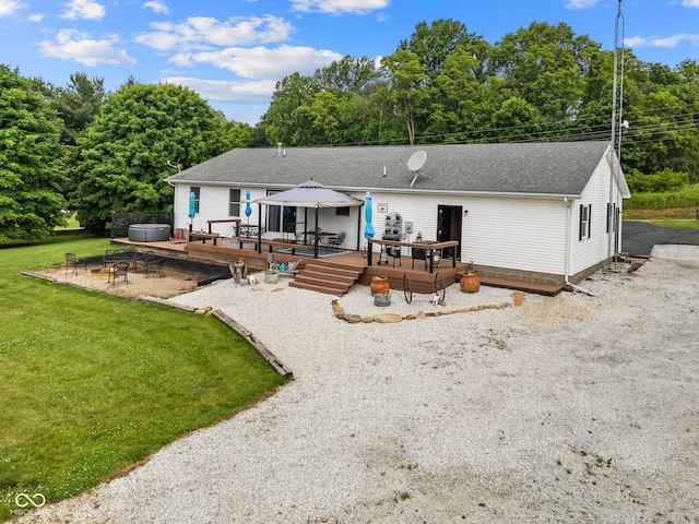 527 E 125 S, Williamsport, IN 47993 - rear view of property with a fire pit, a deck, a shingled roof, a yard, and a gazebo
