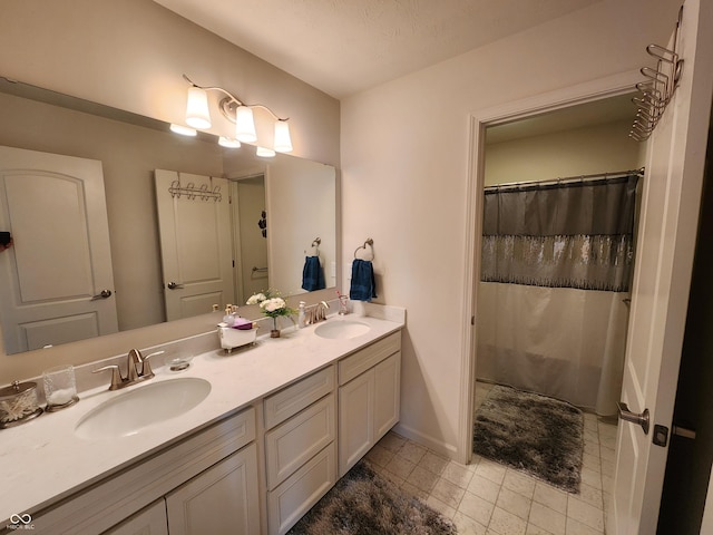6731 Keepsake Dr, Whitestown, IN 46075 - full bathroom featuring double vanity, tile patterned flooring, a shower with shower curtain, and baseboards