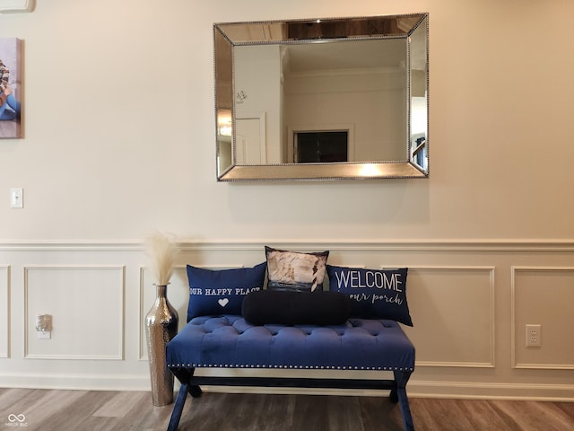 6731 Keepsake Dr, Whitestown, IN 46075 - living area with a decorative wall, wood finished floors, and wainscoting