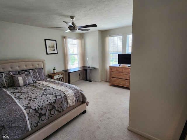 6731 Keepsake Dr, Whitestown, IN 46075 - bedroom with light colored carpet, a ceiling fan, a textured ceiling, and baseboards