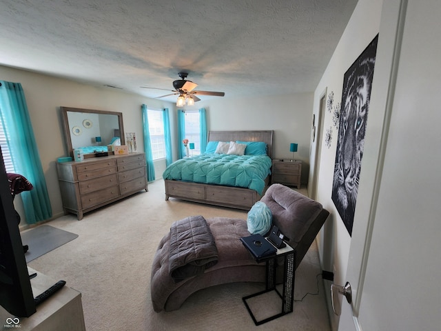 6731 Keepsake Dr, Whitestown, IN 46075 - bedroom featuring light colored carpet, ceiling fan, and a textured ceiling